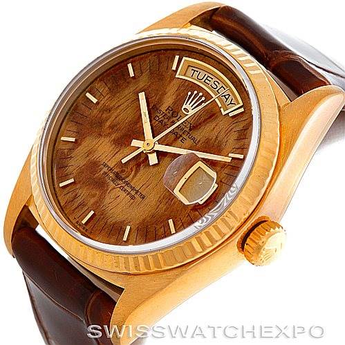 The image shows a Rolex President 18038 Men's Yellow Gold Brown Dial 18038 Men's Yellow Gold Brown Dial model watch from an angled top view, highlighting its dial, bezel, and partial brown leather strap.