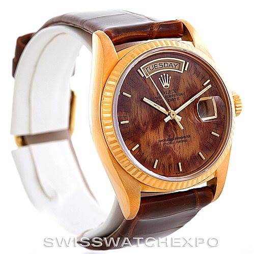 This image shows a Rolex President 18038 Men's Yellow Gold Brown Dial 18038 Men's Yellow Gold Brown Dial model watch at a three-quarter angle, highlighting the wood-textured dial, bezel, and partly the leather strap.