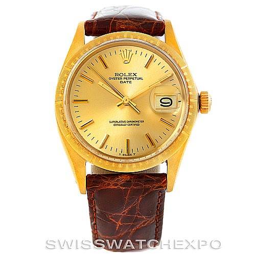 This image shows a frontal view of a Rolex President 1512 Men
s Yellow Gold Champagne Dial 1512 Men
s Yellow Gold Champagne Dial watch, featuring a gold case, a date display, and a brown leather strap.