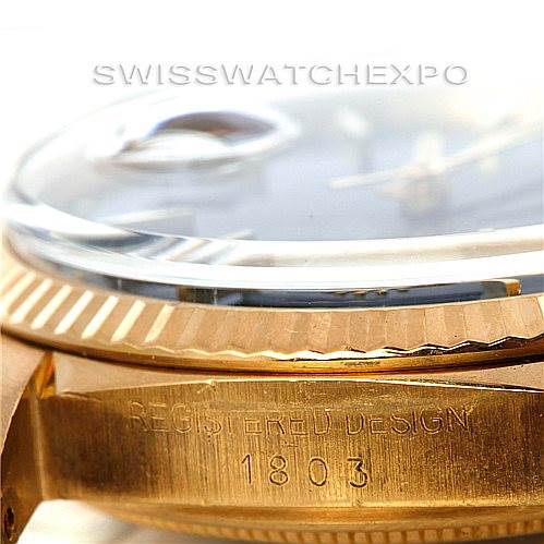 The image shows a close-up of the side of a Rolex President 1803 Men's Yellow Gold Blue Dial 1803 Men's Yellow Gold Blue Dial model watch, focusing on the case and bezel with the design number "1803" engraved.