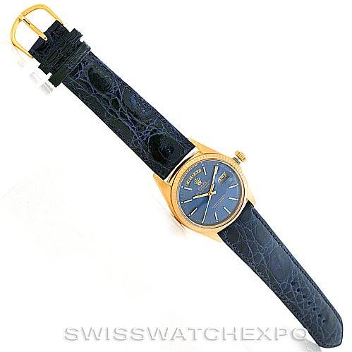 The image shows a full-length view of a Rolex President 1803 Men's Yellow Gold Blue Dial 1803 Men's Yellow Gold Blue Dial watch with a blue leather strap and a gold case.