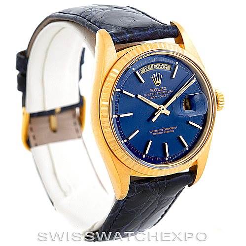 The image shows a Rolex President 1803 Men's Yellow Gold Blue Dial 1803 Men's Yellow Gold Blue Dial model watch from an angled perspective, highlighting its blue dial, day-date display, and leather strap.