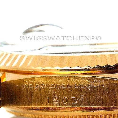 The image shows a close-up side view of the Rolex President 1803 Men's Yellow Gold Brown Dial 1803 Men's Yellow Gold Brown Dial model's case, focusing on its fluted bezel and engraved serial number.