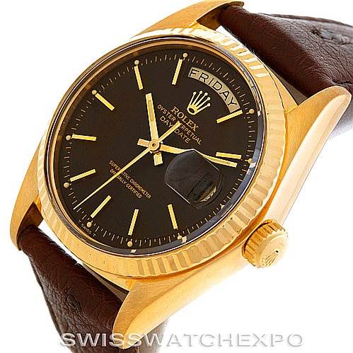 The image shows a Rolex President 1803 Men's Yellow Gold Brown Dial 1803 Men's Yellow Gold Brown Dial watch at an angle revealing its dial, case, fluted bezel, crown, and leather strap.