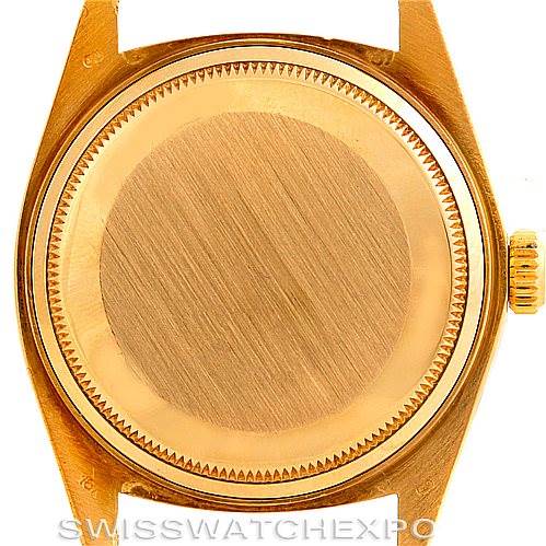 This image shows the back case and crown of a Rolex President 1803 Men's Yellow Gold Brown Dial 1803 Men's Yellow Gold Brown Dial model watch.