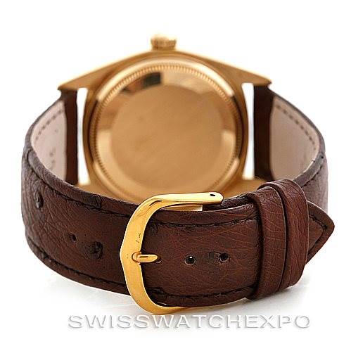 The image shows the back case and a brown leather strap with gold-tone buckle of a Rolex President 1803 Men's Yellow Gold Brown Dial 1803 Men's Yellow Gold Brown Dial model watch.