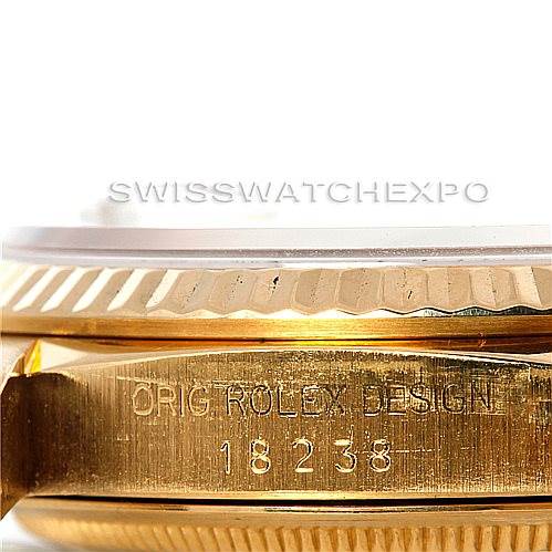 The image shows a close-up side view of a Rolex President 18238 Men's Yellow Gold Grey Dial 18238 Men's Yellow Gold Grey Dial model watch with engravings and fluted bezel.
