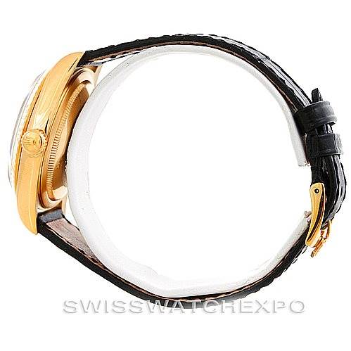 This image shows a Rolex President 18238 Men's Yellow Gold Grey Dial 18238 Men's Yellow Gold Grey Dial model watch from a side view, highlighting the gold case, crown, and black leather strap.