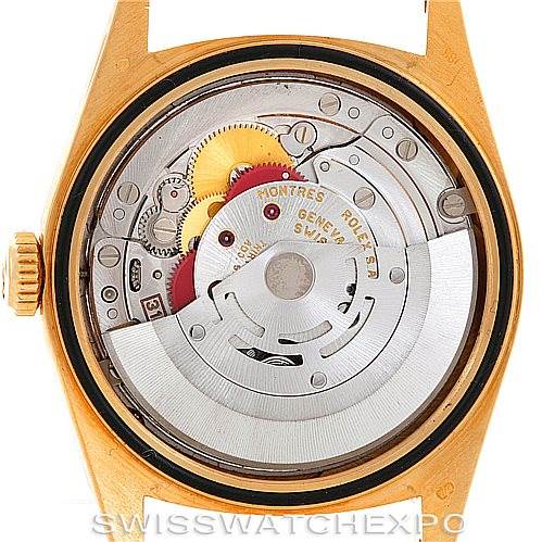 This image shows the back view of a Rolex President 18238 Men's Yellow Gold Black Dial 18238 Men's Yellow Gold Black Dial model, displaying its intricate movement and internal mechanisms.