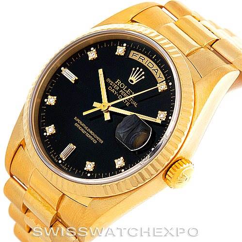 The image shows the front and part of the bracelet of the Rolex President 18238 Men's Yellow Gold Black Dial 18238 Men's Yellow Gold Black Dial model watch with a black dial and gold finish.
