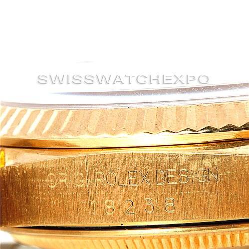 The image shows a close-up of the side engraving and fluted bezel of a Rolex President 18238 Men's Yellow Gold Black Dial 18238 Men's Yellow Gold Black Dial model 18238.