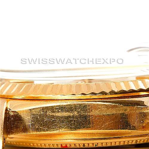 This close-up angle shows the side view of a Rolex President 1803 Men
s Yellow Gold Silver Dial 1803 Men
s Yellow Gold Silver Dial model watch case, highlighting its gold fluted bezel.