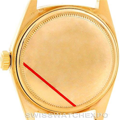 The image shows the case back and part of the crown of a Rolex President 1803 Men
s Yellow Gold Silver Dial 1803 Men
s Yellow Gold Silver Dial watch.