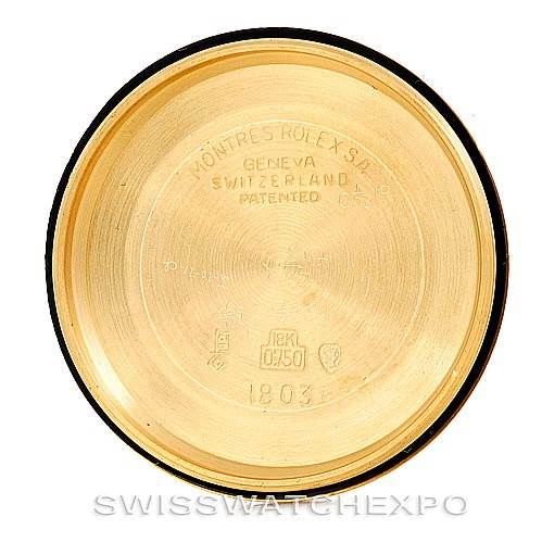 This image shows the inside case back of a Rolex President 1803 Men
s Yellow Gold Silver Dial 1803 Men
s Yellow Gold Silver Dial model watch, featuring various engravings including the brand name and location.