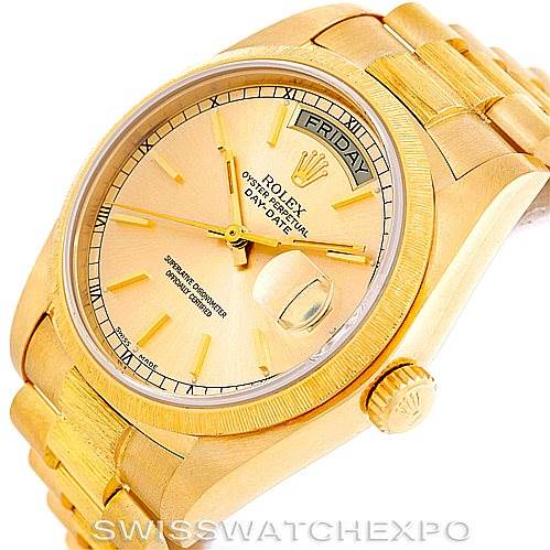 The image shows a Rolex President 18078 Men
s Yellow Gold Champagne Dial 18078 Men
s Yellow Gold Champagne Dial model watch from an angled view, highlighting the face, crown, and part of the bracelet.