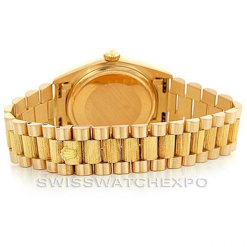 The image shows the back case and bracelet of a Rolex President 18078 Men
s Yellow Gold Champagne Dial 18078 Men
s Yellow Gold Champagne Dial model watch, emphasizing its gold finish and signature design.