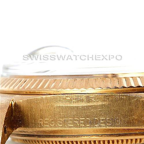 The image shows a close-up of the side view of the Rolex President 1803 Men
s Yellow Gold Champagne Dial 1803 Men
s Yellow Gold Champagne Dial model watch, focusing on the bezel and case.