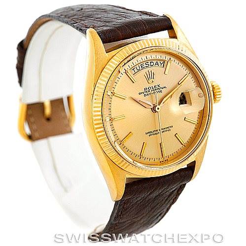 This image shows a Rolex President 1803 Men
s Yellow Gold Champagne Dial 1803 Men
s Yellow Gold Champagne Dial watch, featuring its gold case, fluted bezel, champagne dial, day-date display, and leather strap.