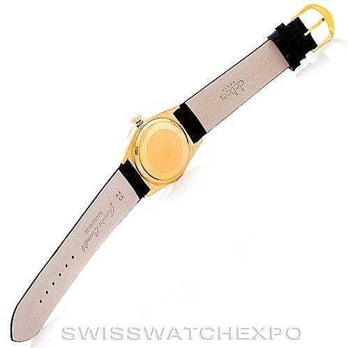 This image shows the back of a Rolex President 18038 Men
s Yellow Gold Champagne Dial 18038 Men
s Yellow Gold Champagne Dial model watch with its leather strap and gold case.