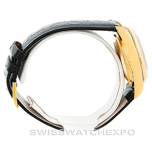 The image shows a side angle view of a Rolex President 18038 Men
s Yellow Gold Champagne Dial 18038 Men
s Yellow Gold Champagne Dial model watch, highlighting its black leather strap and gold case.