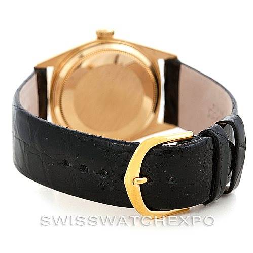 The image shows the back, sides, and clasp of a Rolex President 18038 Men
s Yellow Gold Champagne Dial 18038 Men
s Yellow Gold Champagne Dial watch, featuring a gold case and black leather strap.