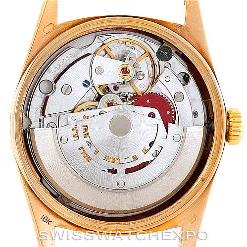 This image shows the back view of a Rolex President 18038 Men
s Yellow Gold Champagne Dial 18038 Men
s Yellow Gold Champagne Dial model watch, displaying its internal mechanical movement.