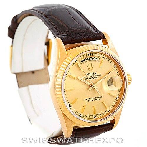 The image shows a Rolex President 18038 Men
s Yellow Gold Champagne Dial 18038 Men
s Yellow Gold Champagne Dial model watch at a three-quarter angle, highlighting its gold case, dial, and brown leather strap.