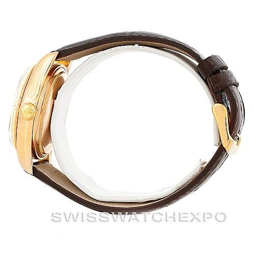 This image shows a side view of a Rolex President 18038 Men
s Yellow Gold Champagne Dial 18038 Men
s Yellow Gold Champagne Dial model watch with a brown leather strap and gold buckle.