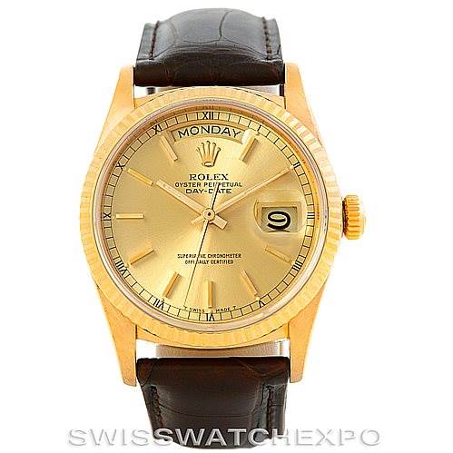 The Rolex President 18038 Men
s Yellow Gold Champagne Dial 18038 Men
s Yellow Gold Champagne Dial model watch is shown from the front, featuring its gold case, Roman numeral dial, day display, and brown leather strap.