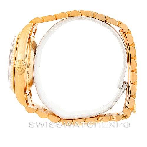 The image shows a side view of a Rolex President 18238 Men's Yellow Gold White Dial 18238 Men's Yellow Gold White Dial model watch, highlighting the crown, bezel, and bracelet.