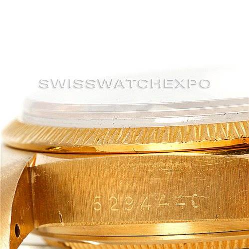 This close-up image shows the side view of the case and the serial number of a Rolex President 18078 Men
s Yellow Gold Champagne Dial 18078 Men
s Yellow Gold Champagne Dial model watch.