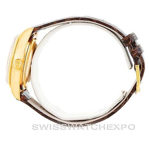 The image shows a side view of the Rolex President 18078 Men
s Yellow Gold Champagne Dial 18078 Men
s Yellow Gold Champagne Dial model watch, highlighting the crown and side case with a leather strap.