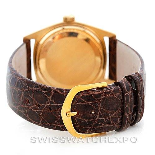 The image shows the back case and leather strap with a gold buckle of a Rolex President 18078 Men
s Yellow Gold Champagne Dial 18078 Men
s Yellow Gold Champagne Dial model watch.