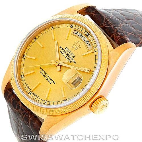 The image shows a Rolex President 18078 Men
s Yellow Gold Champagne Dial 18078 Men
s Yellow Gold Champagne Dial model watch from a slightly tilted angle, highlighting the dial, bezel, crown, and part of the brown leather strap.