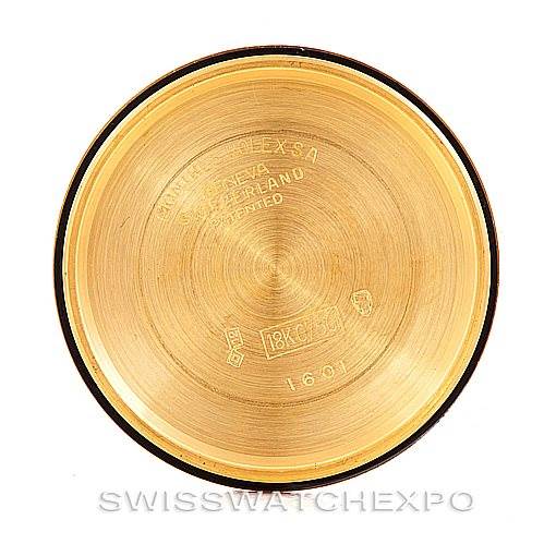 This image shows the inside case back of a Rolex President 1601 Men's Yellow Gold Black Dial 1601 Men's Yellow Gold Black Dial model watch, highlighting the engravings and gold finish.