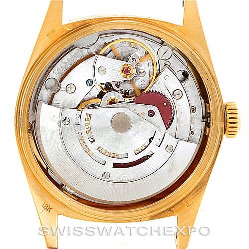 This image shows the open case back view of the Rolex President 18038 Men
s Yellow Gold Champagne Dial 18038 Men
s Yellow Gold Champagne Dial model, revealing its intricate mechanical movement.