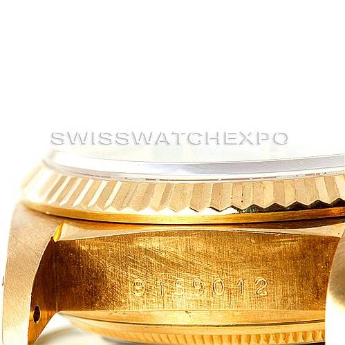 This image shows the side profile of the Rolex President 18038 Men
s Yellow Gold Champagne Dial 18038 Men
s Yellow Gold Champagne Dial watch, highlighting the bezel and part of the case with engravings.