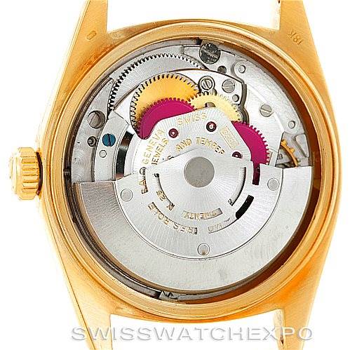 This image shows the internal mechanics of a Rolex President 1803 Men's Yellow Gold White Dial 1803 Men's Yellow Gold White Dial model watch, viewed from the back with its case opened.