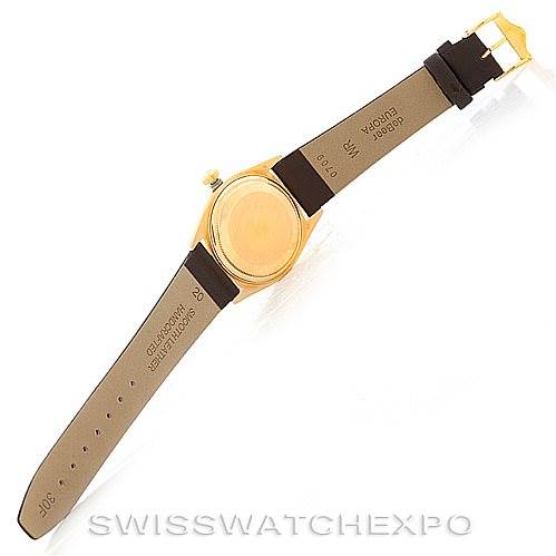 This image shows the back case and leather straps of the Rolex President 1803 Men's Yellow Gold White Dial 1803 Men's Yellow Gold White Dial model watch, positioned at an angle facing downward.