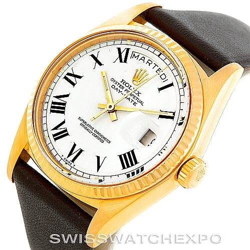 This image shows a close-up, angled view of a Rolex President 1803 Men's Yellow Gold White Dial 1803 Men's Yellow Gold White Dial model watch, highlighting its face, crown, and part of the leather strap.