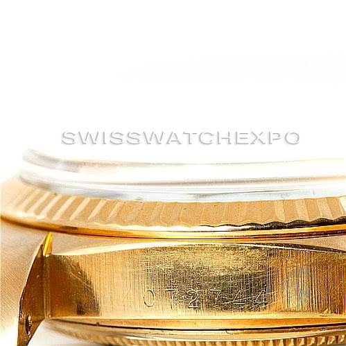This close-up image shows the side of the Rolex President 1803 Men's Yellow Gold White Dial 1803 Men's Yellow Gold White Dial watch case, highlighting the serial number and part of the fluted bezel.
