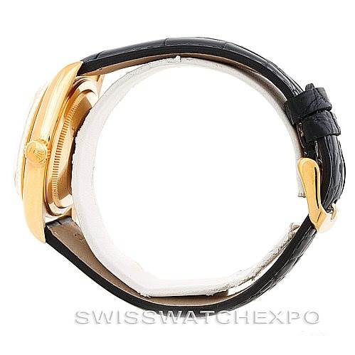 This image shows a side view of a Rolex President 18238 Men
s Yellow Gold Champagne Dial 18238 Men
s Yellow Gold Champagne Dial model watch with a gold case and a black leather strap.