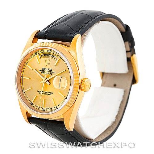 This image shows a Rolex President 18238 Men
s Yellow Gold Champagne Dial 18238 Men
s Yellow Gold Champagne Dial model watch angled slightly from the side, showcasing the dial, bezel, and leather strap.