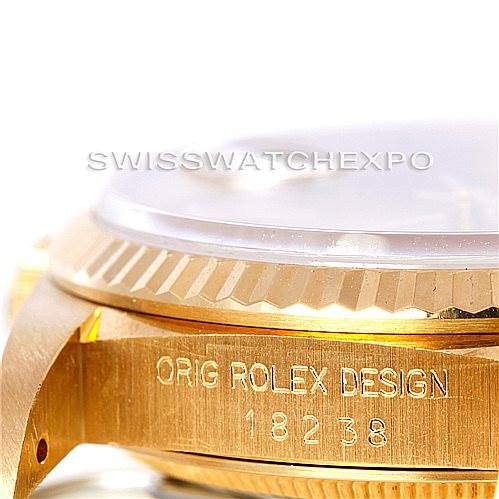 The image shows a close-up, angled view of the case and side of the dial of a Rolex President 18238 Men
s Yellow Gold Champagne Dial 18238 Men
s Yellow Gold Champagne Dial model watch, highlighting the engraved details.