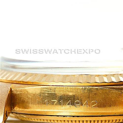 This image shows a close-up of the side of a Rolex President 1601 Men
s Yellow Gold Champagne Dial 1601 Men
s Yellow Gold Champagne Dial model watch, highlighting the serial number on the gold case.