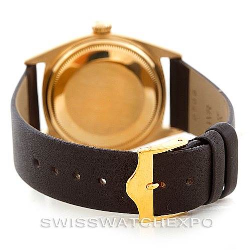 This image shows the back case and leather strap of a Rolex President 1601 Men
s Yellow Gold Champagne Dial 1601 Men
s Yellow Gold Champagne Dial model watch, viewed from a rear angle.