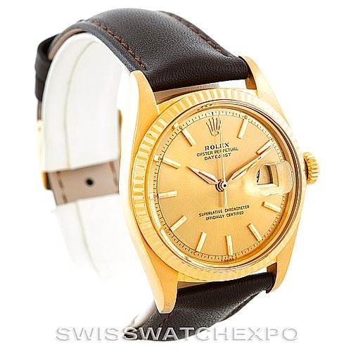 This image shows a frontal view of a Rolex President 1601 Men
s Yellow Gold Champagne Dial 1601 Men
s Yellow Gold Champagne Dial watch, highlighting its gold case, black leather strap, and dial details.