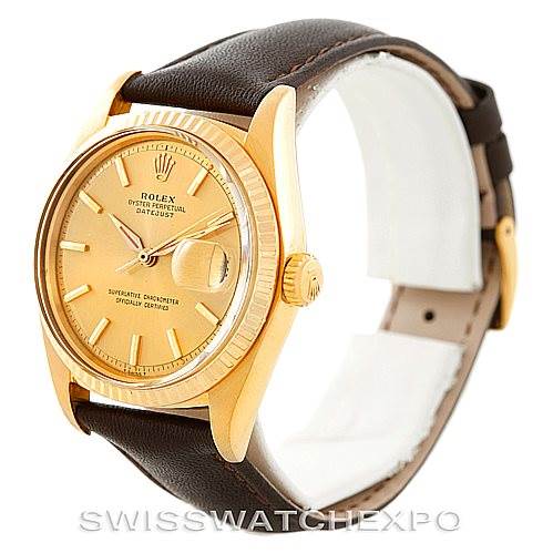 The image shows a side angle of a Rolex President 1601 Men
s Yellow Gold Champagne Dial 1601 Men
s Yellow Gold Champagne Dial watch, highlighting its gold case, light brown leather strap, and dial.