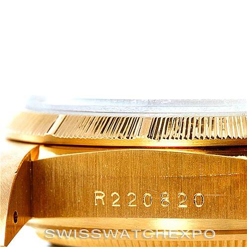 The image shows a close-up side angle of a Rolex President 18078 Men
s Yellow Gold Champagne Dial 18078 Men
s Yellow Gold Champagne Dial watch, focusing on the case and bezel with engraved serial number.