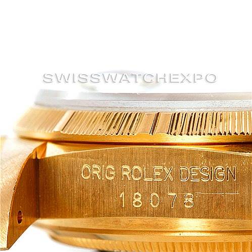 The image shows a close-up side view of a Rolex President 18078 Men
s Yellow Gold Champagne Dial 18078 Men
s Yellow Gold Champagne Dial model watch, highlighting the engraved case and fluted bezel.